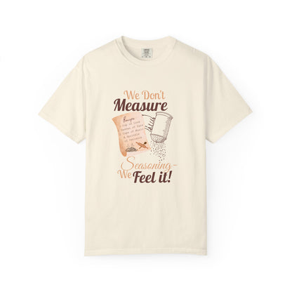 Cozy T-Shirt: "We Don't Measure Seasoning, We Feel It!" - Perfect for Home Cooks & Food Lovers