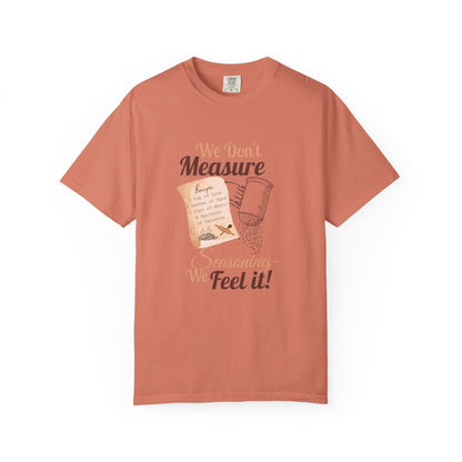 Cozy T-Shirt: "We Don't Measure Seasoning, We Feel It!" - Perfect for Home Cooks & Food Lovers
