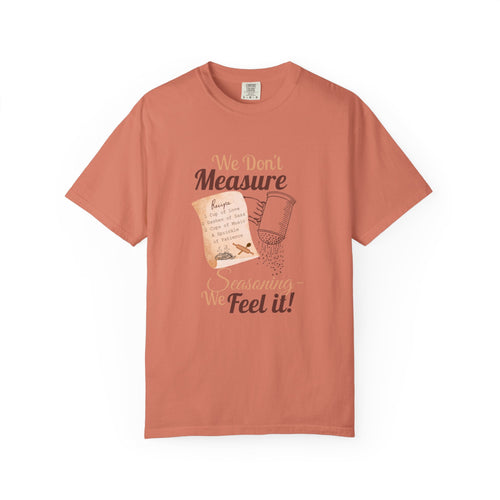 Cozy T-Shirt: "We Don't Measure Seasoning, We Feel It!" - Perfect for Home Cooks & Food Lovers